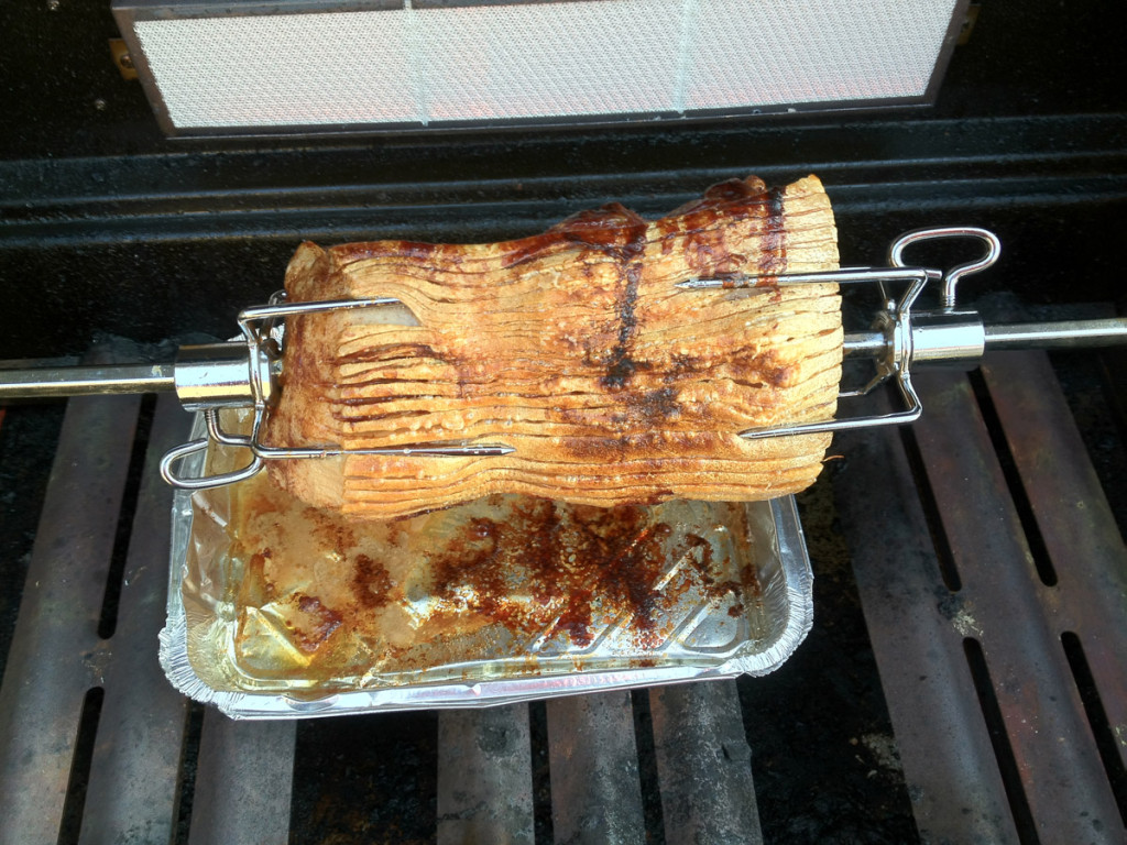 Rotisserie-grilled pork roast with crispy rind
